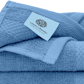 White Classic washcloths feature reinforced double-stitched edges for durability.