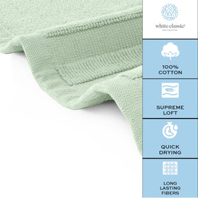 Green White Classic bath mat positioned in a modern bathroom
