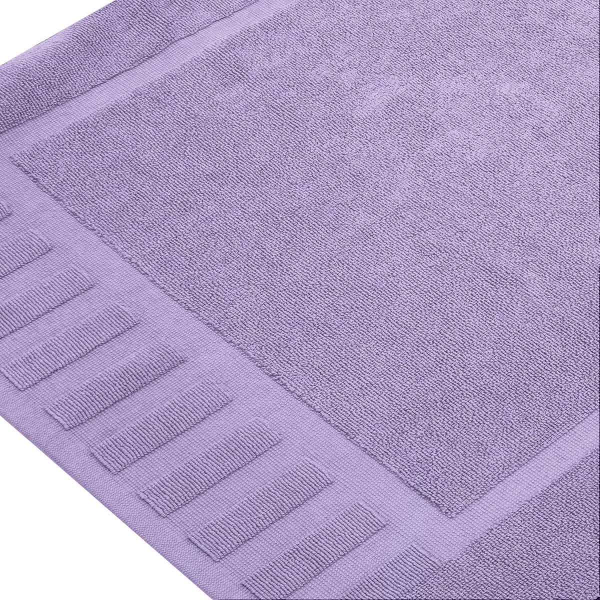 White Classic hotel spa quality bath mat in a bright bathroom.