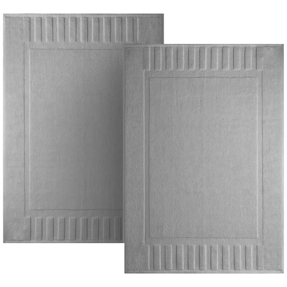 White Classic luxury bath mat 22x34 placed by the shower for plush step-out comfort