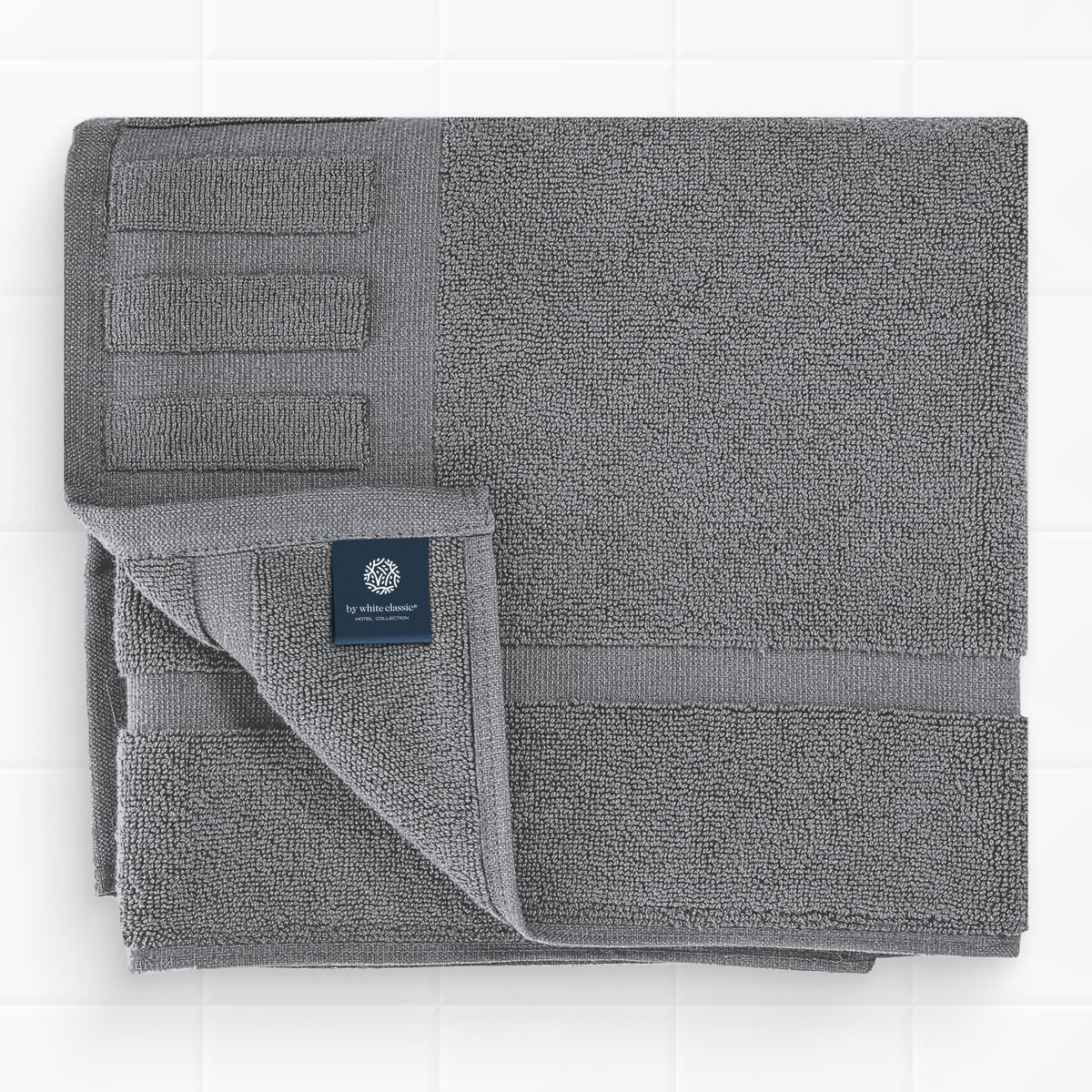 White Classic Luxury Bath Mat placed by the sink for everyday luxury.