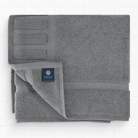 White Classic Luxury Bath Mat placed by the sink for everyday luxury.