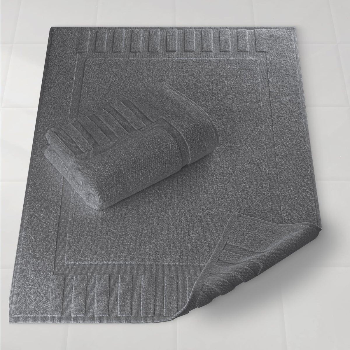 White Classic Luxury Bath Mat with plush fibers for spa-like comfort after showers.