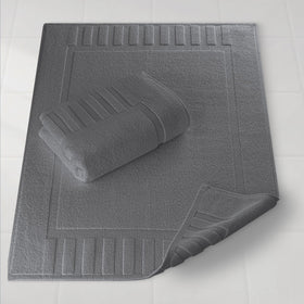 White Classic Luxury Bath Mat with plush fibers for spa-like comfort after showers.
