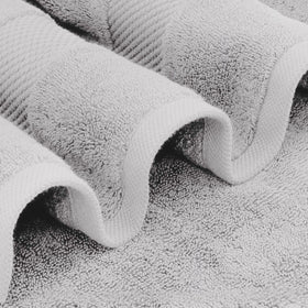 White Classic luxury bath sheet in a towel pile emphasizes plush absorbency