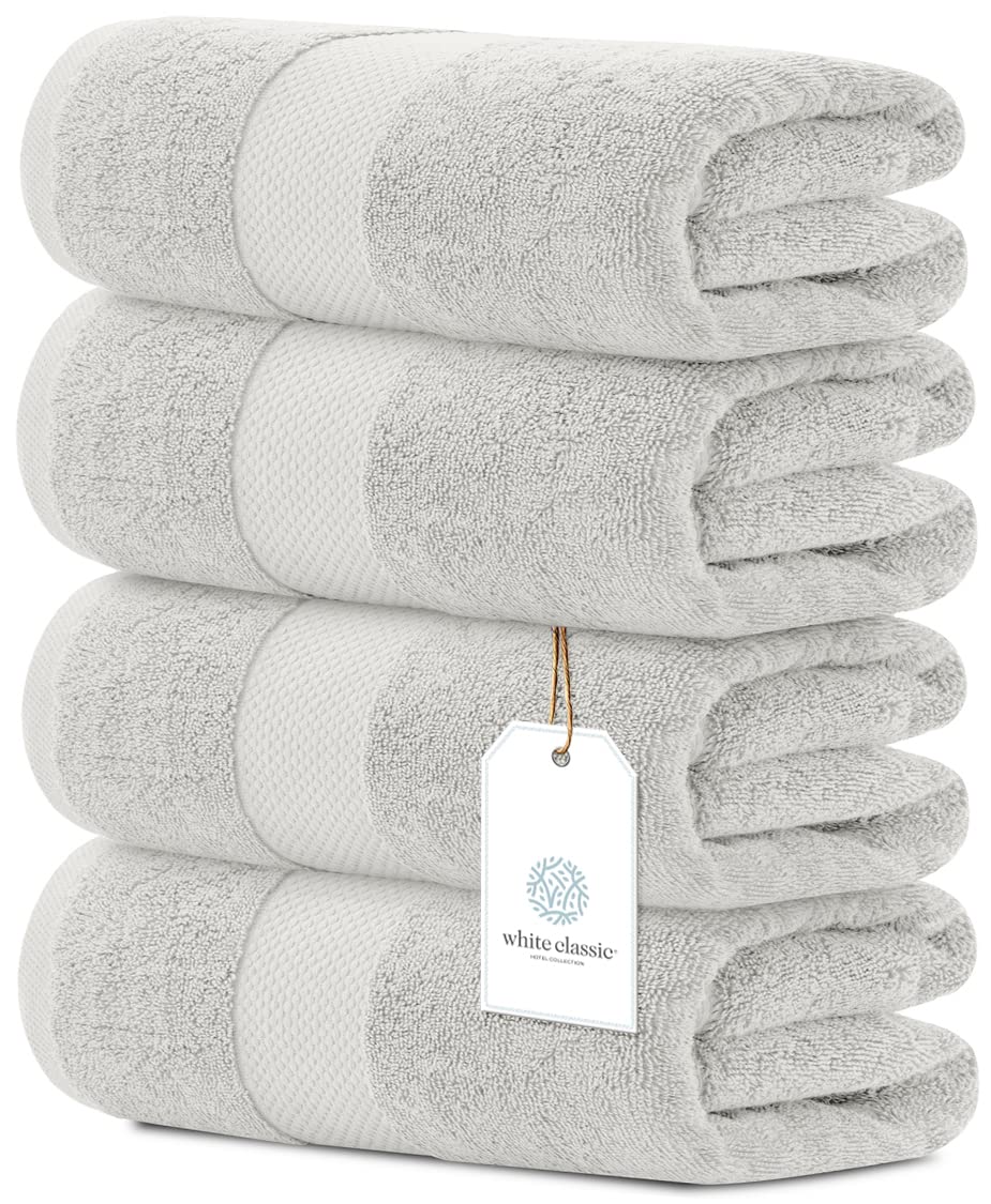 White Classic luxury bath towels set folded to show plush softness and generous 27x54 size.