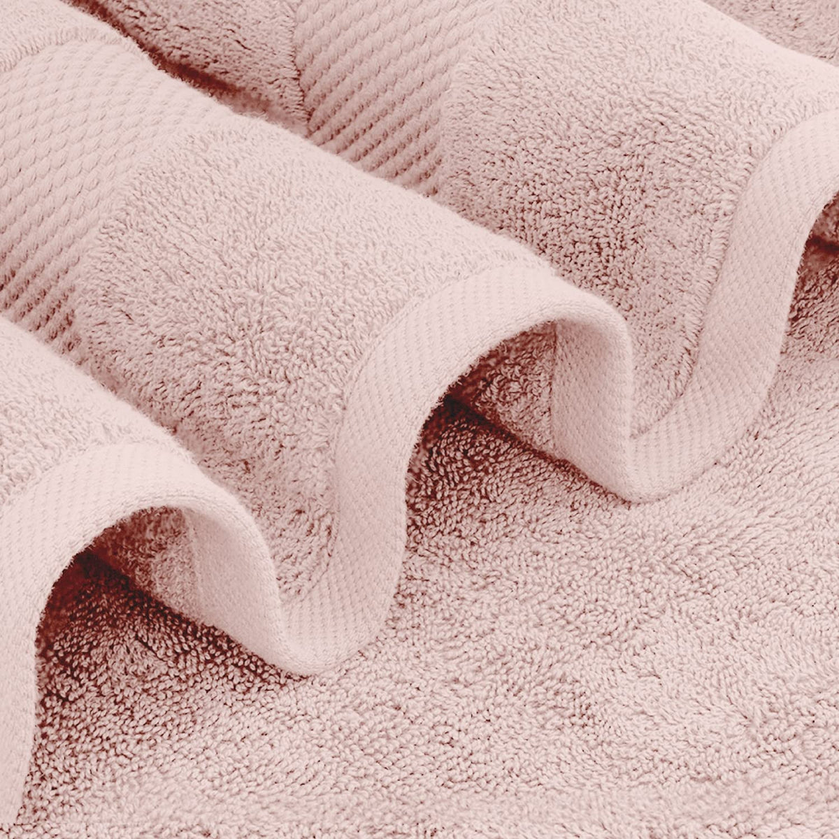 White Classic pink towels close-up knit, emphasizing 700 GSM premium cotton.