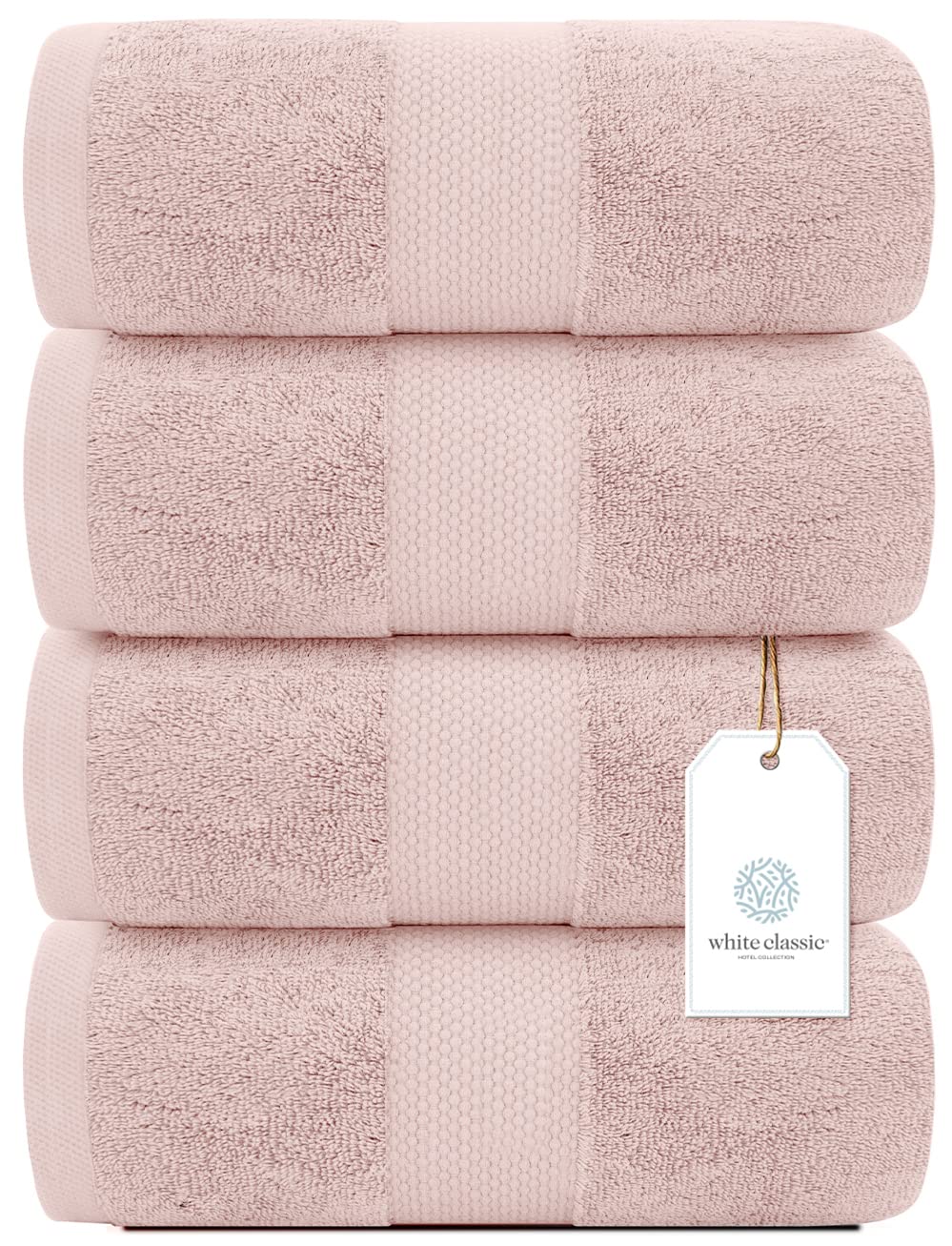 White Classic pink towels draped on a rack, highlighting hotel-grade softness.