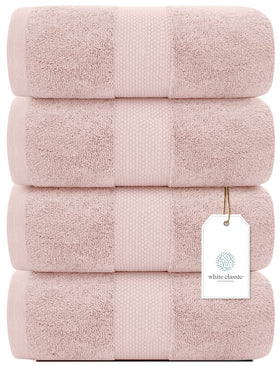 White Classic pink towels draped on a rack, highlighting hotel-grade softness.