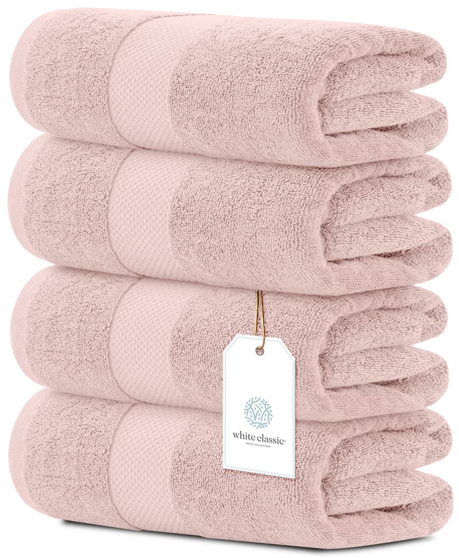 White Classic pink towels folded, showcasing plush luxury for daily spa-like routines.