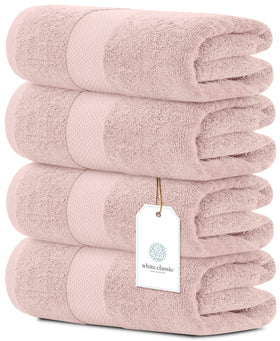 White Classic pink towels folded, showcasing plush luxury for daily spa-like routines.