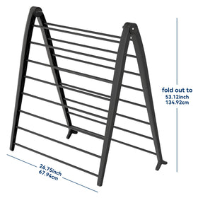 Whitmor Spacemaker drying rack leaning against a wall for space-saving setup.