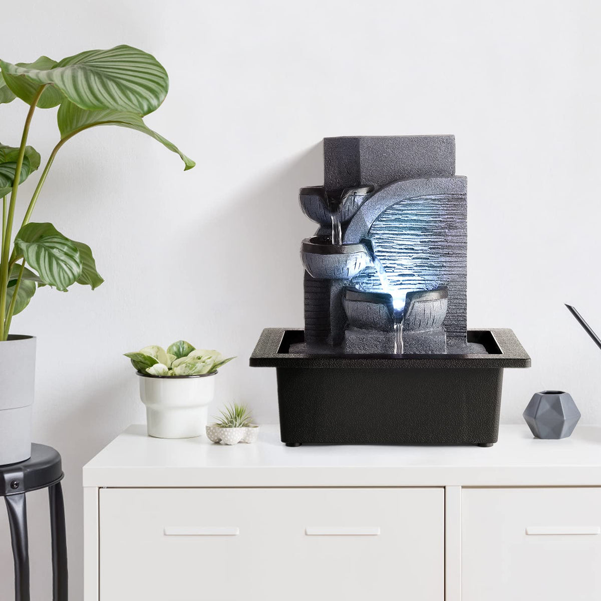 WICHEMI tabletop water fountain LED light illuminates cascading tiers for calming ambiance.