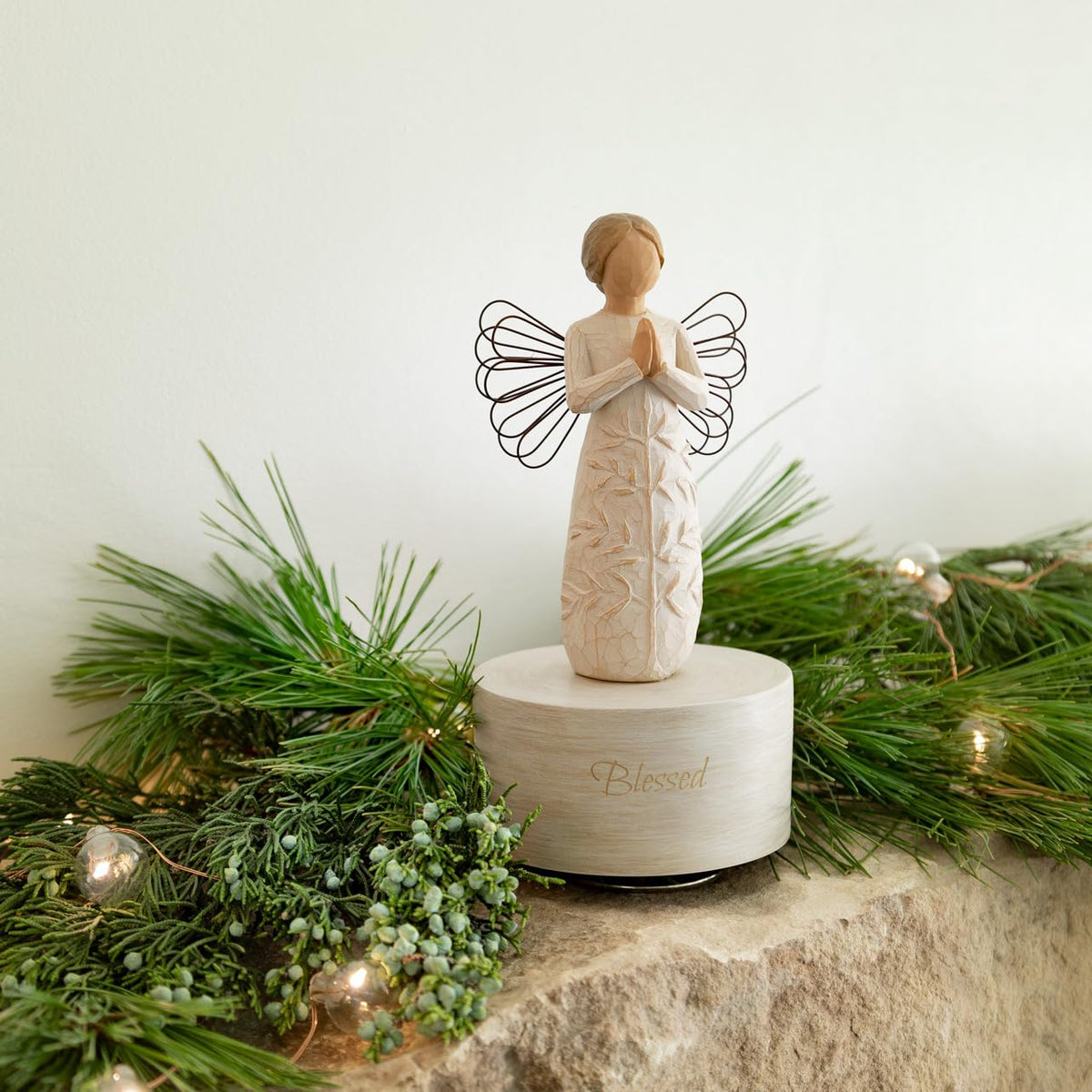 Willow Tree hand-painted sculpture rotates to music, adding a serene focal point at home.