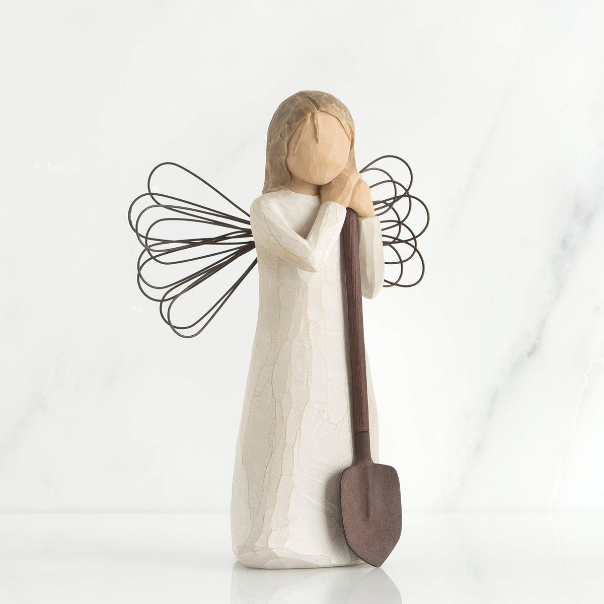 Willow Tree Angel with wire wings, garden-themed display piece.