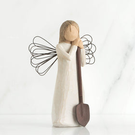Willow Tree Angel with wire wings, garden-themed display piece.