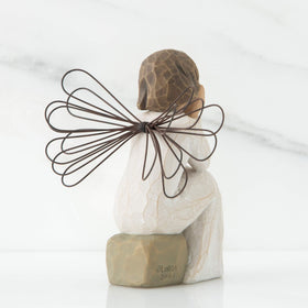 Willow Tree Angel of Caring hand-painted resin figure with thoughtful pose.