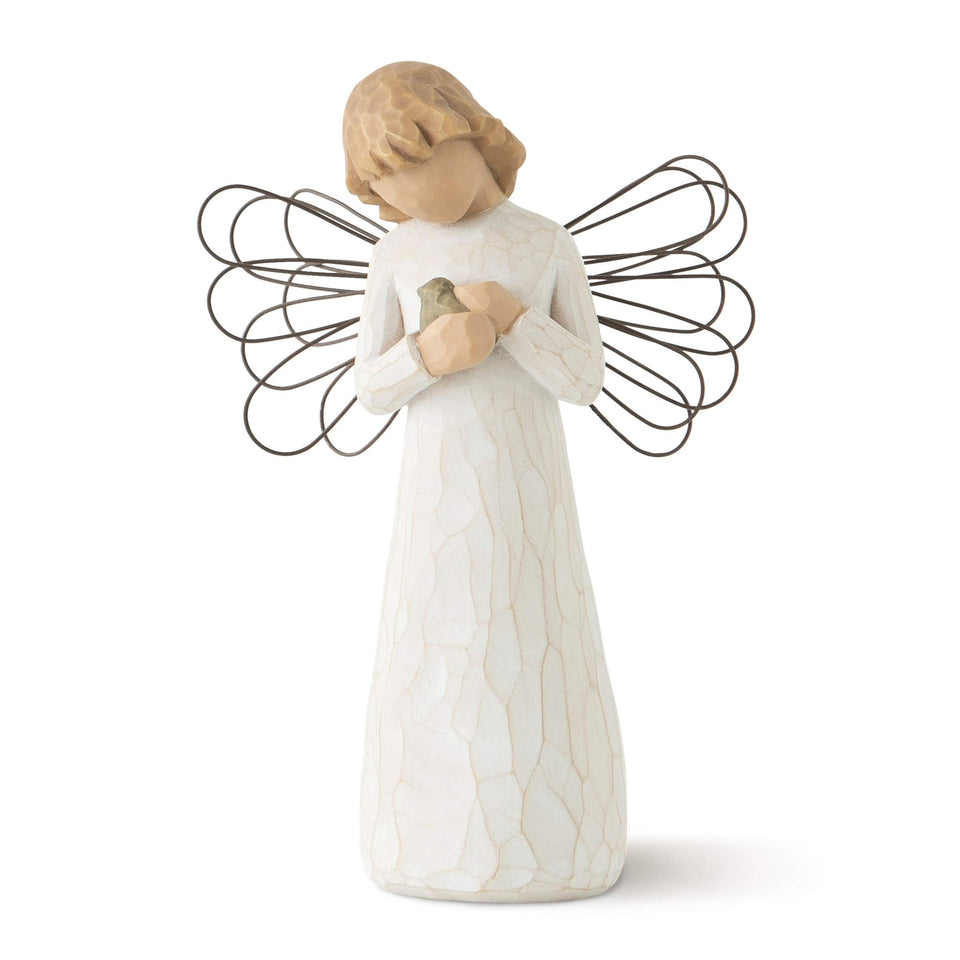 Willow Tree Angel of Healing in cream dress, hand-painted, adds gentle decor to a shelf.