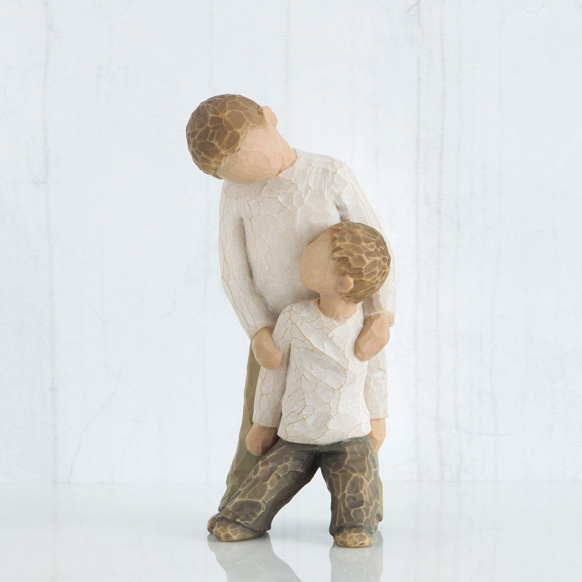 Willow Tree Brothers hand-painted resin figure adds warmth to shelves.