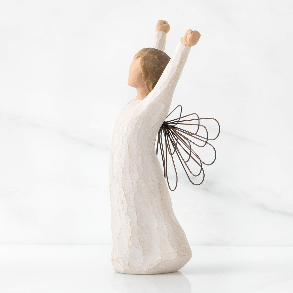 Willow Tree Courage Angel hand-painted resin, showcasing craftsmanship and collectible charm.
