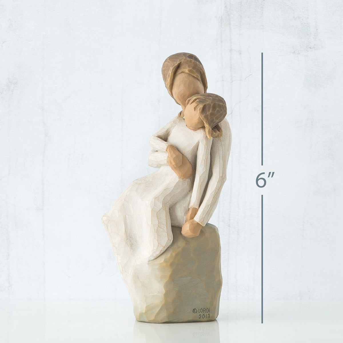 Willow Tree cream dress figure on gray rock, display-ready keepsake