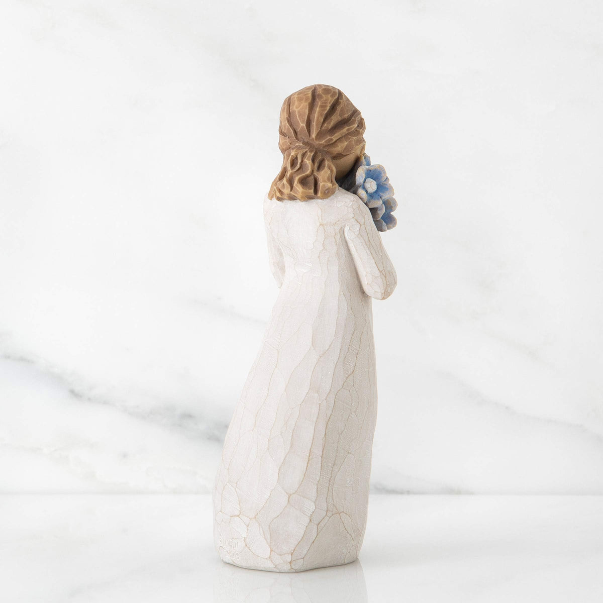 Willow Tree Forget-me-not figure on a table, ready for display and gifting