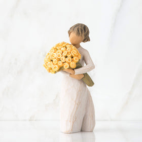 Willow Tree Good Cheer standing figure with yellow rose bouquet, perfect for display.