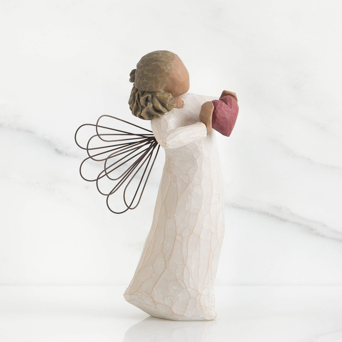 Willow Tree hand-painted figure emphasizes texture and detail.
