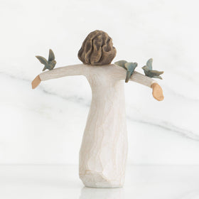 Willow Tree Happiness cream dress figure, hand-painted detail for display.