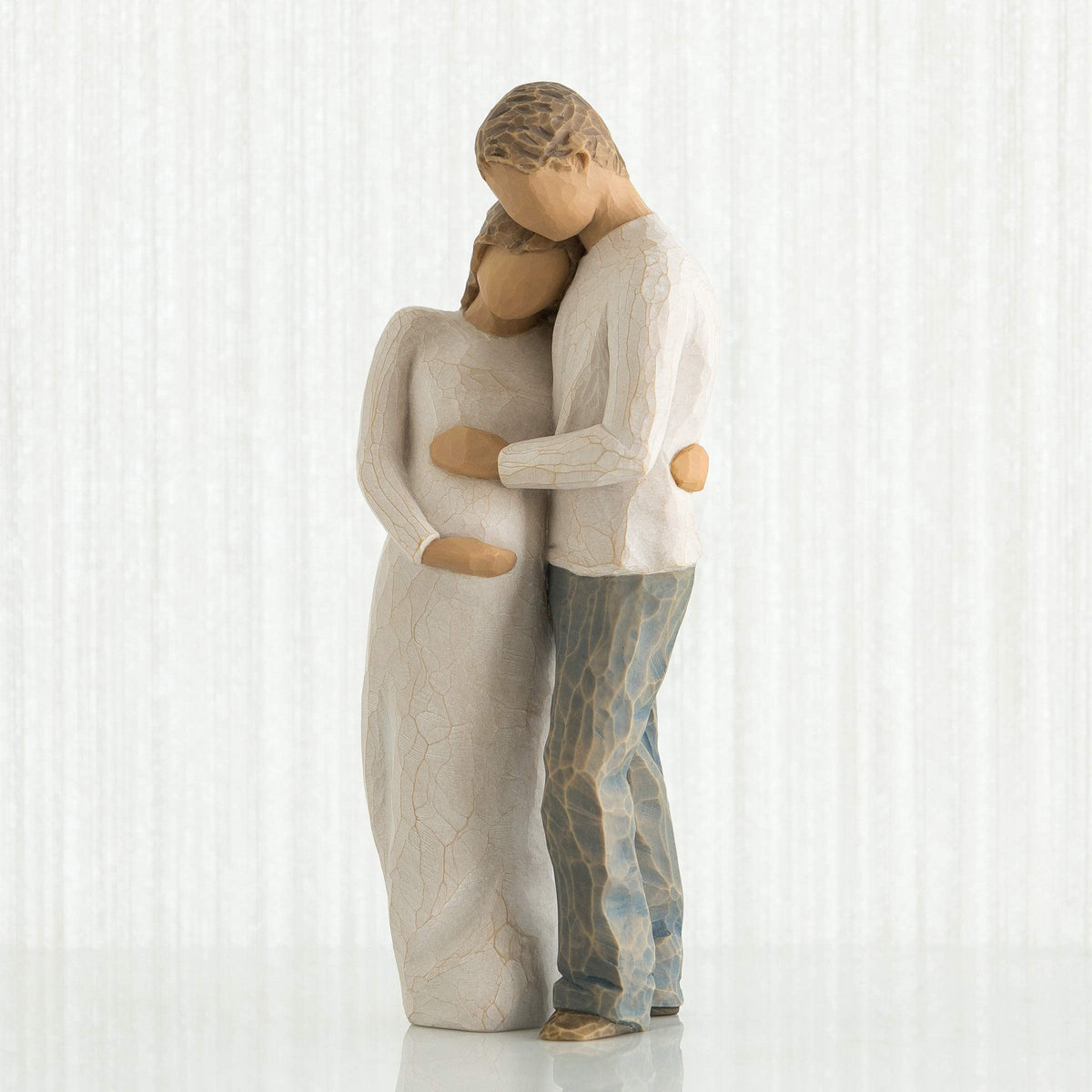 Willow Tree Home figure, pregnant woman in cream dress, symbolizing new beginnings