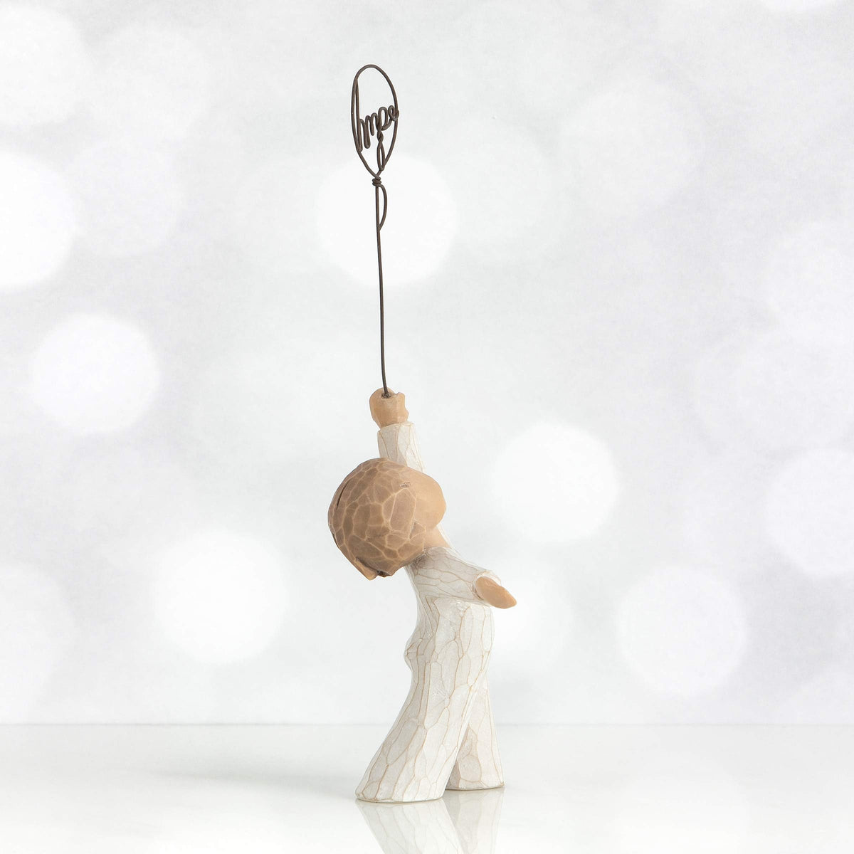 Willow Tree Hope figure hand-painted details highlight soft textures.