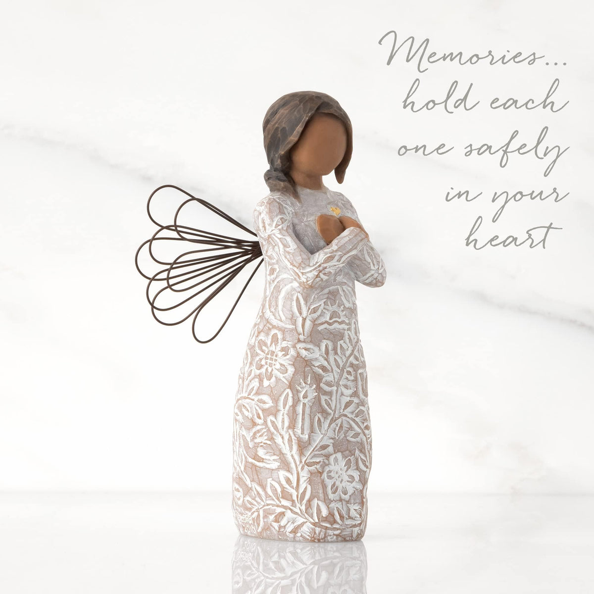 Willow Tree Remembrance Angel features a gold leaf heart and symbolic dress for sympathy.
