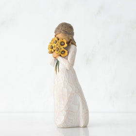 Willow Tree Warm Embrace in cream dress brightens any shelf.