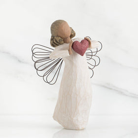 Willow Tree hand-painted resin figure showcasing artisan craftsmanship.