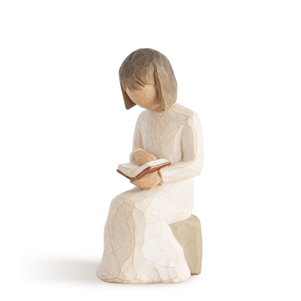 Willow Tree Wisdom reading a book on a gray rock, ideal study-space display.