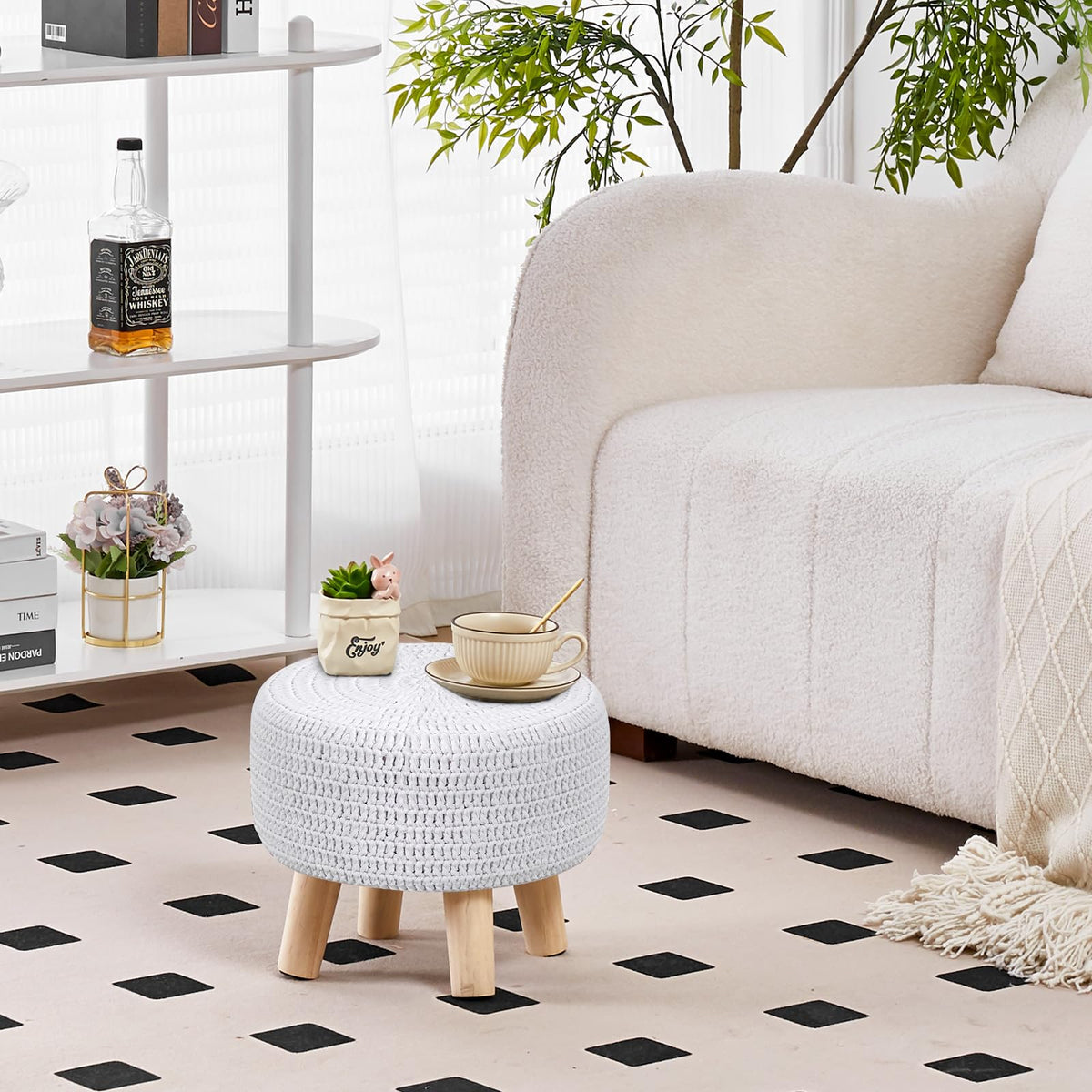 Wimarsbon pouf with non-skid wood legs stays securely in place.