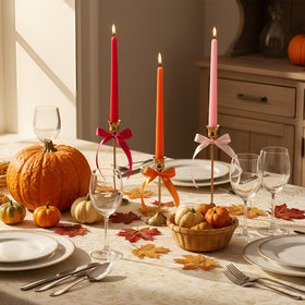 Windkream rose red taper candles highlight dramatic wedding centerpieces