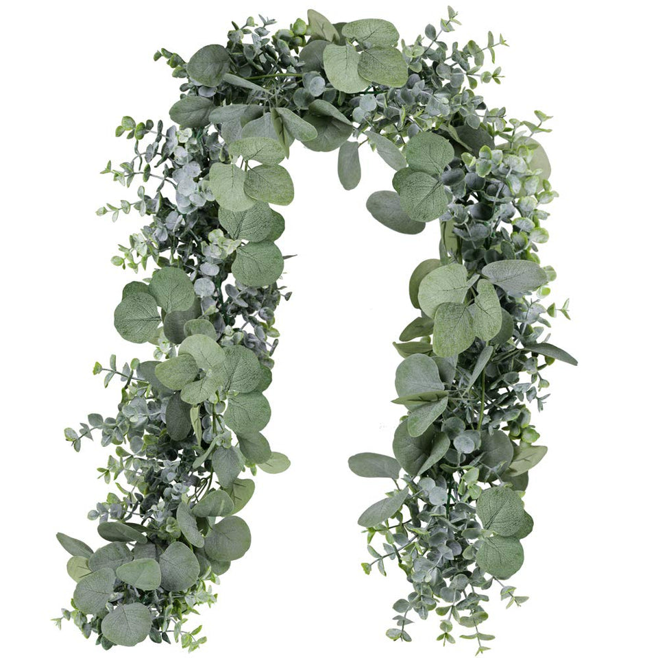 Winlyn 5.9' silver dollar eucalyptus garland draped over a wedding arch for a lush backdrop.