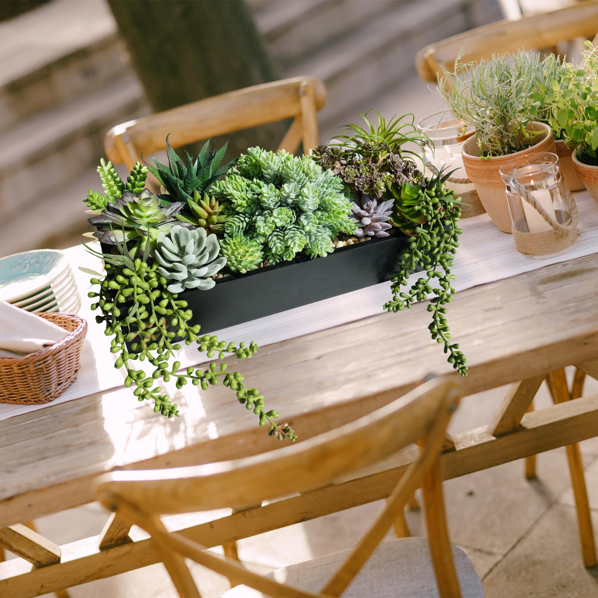 Pebble bed in black planter enhances natural, realistic look.