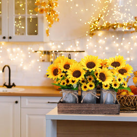 Winlyn centerpiece display featuring sunflowers arranged across dining table setup.