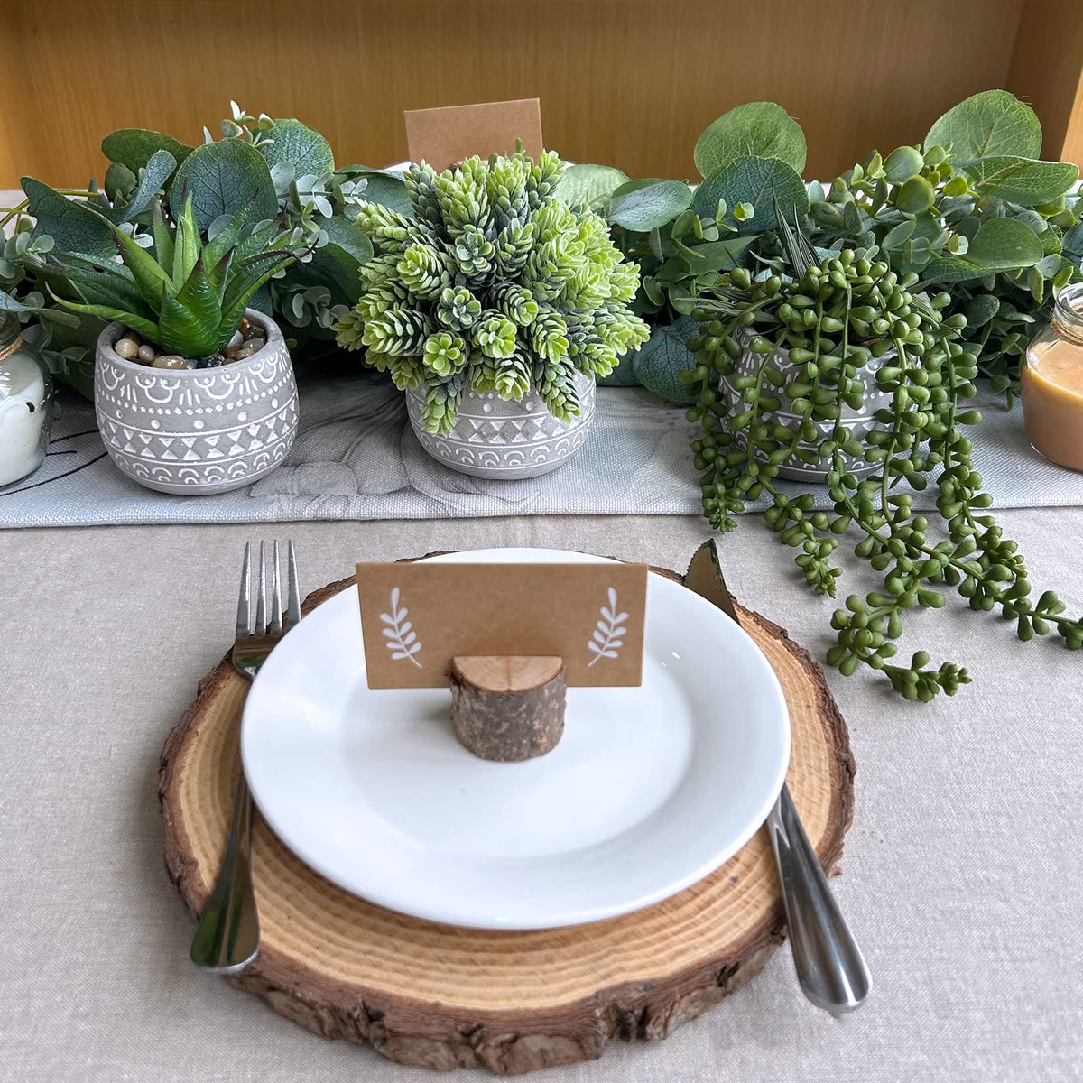 Winlyn small table centerpiece arrangement featuring compact faux plants