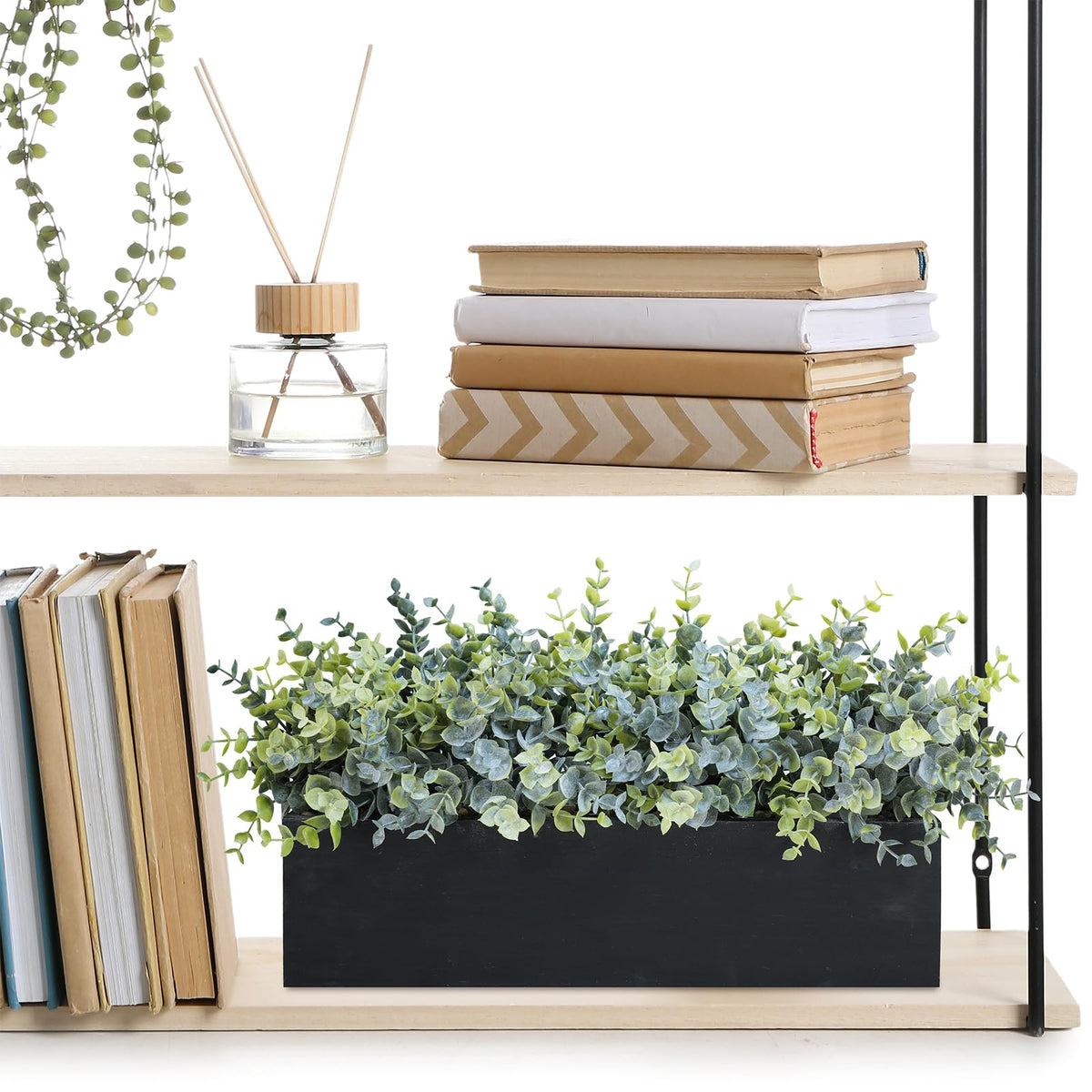 Wedding centerpiece idea using Winlyn eucalyptus in a black wood planter.