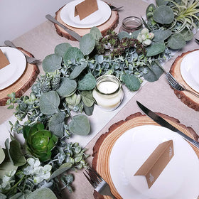 Winlyn eucalyptus garland framing a welcome sign for a cohesive event look.