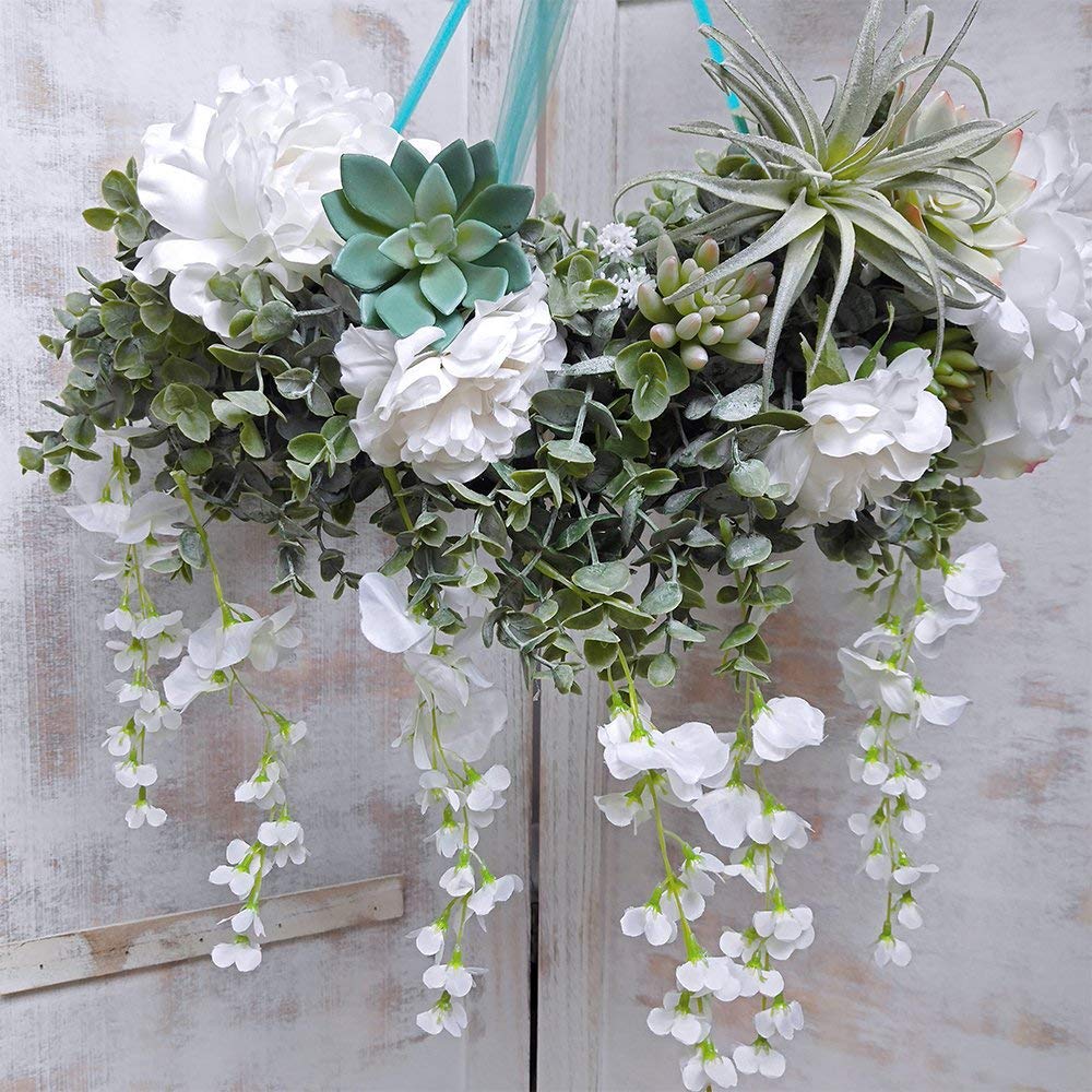Winlyn frosted green eucalyptus garland adds a frosted arch-backdrop effect.