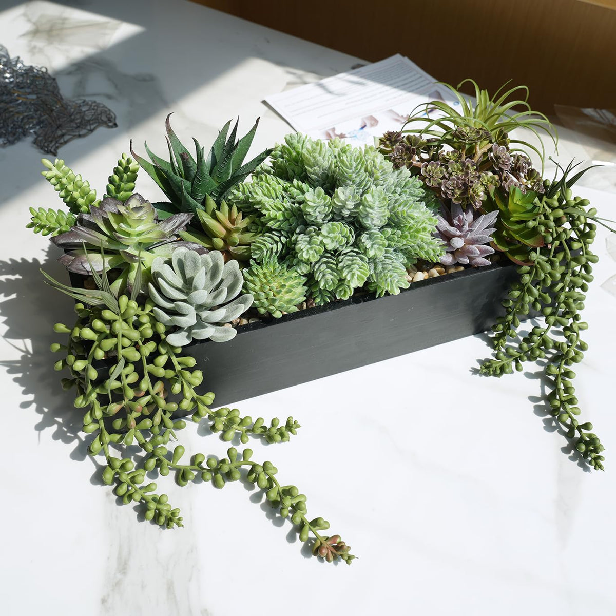 Flocked textures add depth and realism to artificial succulents.