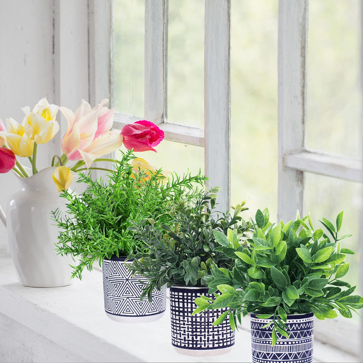 Winlyn Aztec-inspired pots frame lush greenery for stylish indoor display.