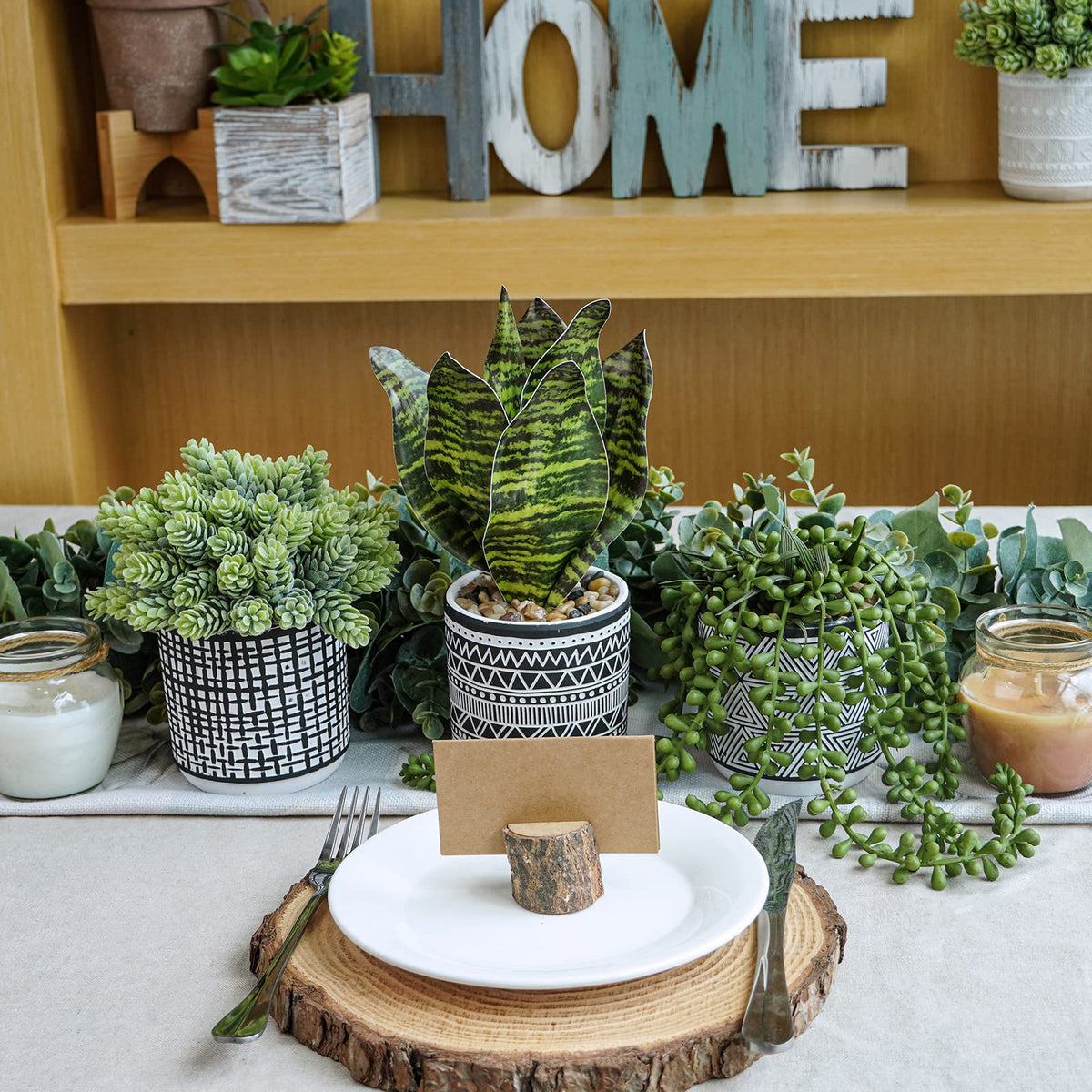Winlyn small artificial plants on a desk create a stylish focal point.