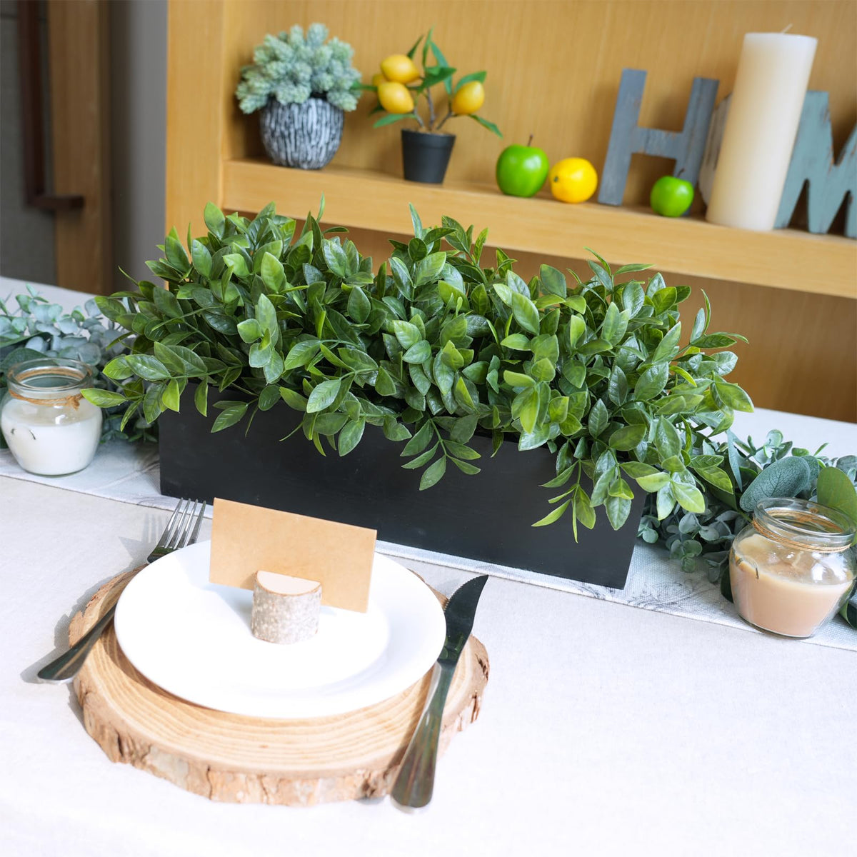Boxwood arrangement on a windowsill, low-maintenance decor.