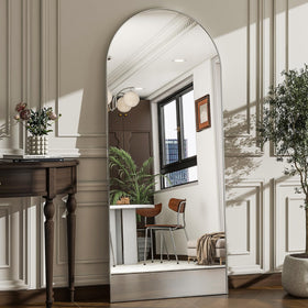 WISSMIELS arched full-length mirror in living room for a spacious, polished look.