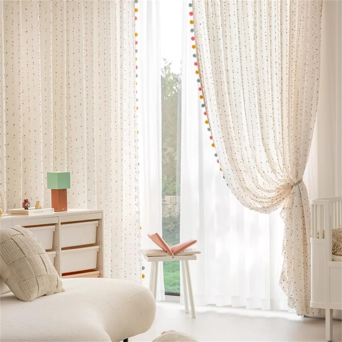 WJLQLM colorfully pom-pom curtain detail adds playful texture to windows.